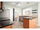 Open concept kitchen with granite countertops and view of the living room at 1265 Birchwood Ln, Roswell, GA 30076