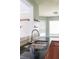 Modern kitchen featuring black countertop and stainless steel faucet at 1265 Birchwood Ln, Roswell, GA 30076