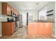 Well-lit kitchen with modern appliances, granite countertops, and custom wooden cabinets at 1265 Birchwood Ln, Roswell, GA 30076