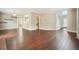 Spacious open-concept living area with hardwood floors and seamless flow to adjacent rooms at 1265 Birchwood Ln, Roswell, GA 30076