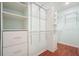 Organized walk-in closet features shelving and drawers at 1265 Birchwood Ln, Roswell, GA 30076