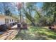 Well-maintained backyard showcasing a spacious wooden deck with a grill, ideal for outdoor living at 2530 Parkdale Pl, Atlanta, GA 30305