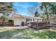 Backyard featuring a white painted brick home and a spacious wooden deck at 2530 Parkdale Pl, Atlanta, GA 30305
