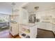 Open-concept kitchen with stainless steel appliances and view to cozy living room at 2530 Parkdale Pl, Atlanta, GA 30305