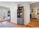 Spacious living room features a gray bookshelf, hardwood floors and access to other rooms at 2530 Parkdale Pl, Atlanta, GA 30305