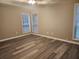 Cozy bedroom with natural light, double windows and gray vinyl flooring at 263 Northwind Dr, Stockbridge, GA 30281
