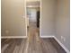 Dining room with luxury vinyl plank flooring leading into the kitchen area with neutral paint at 263 Northwind Dr, Stockbridge, GA 30281