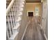 Inviting entryway featuring new luxury vinyl plank flooring, staircase and a view of the fireplace at 263 Northwind Dr, Stockbridge, GA 30281