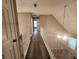 Second floor hallway featuring wood-look flooring and natural light at 263 Northwind Dr, Stockbridge, GA 30281