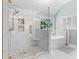 Large walk in shower with a glass enclosure, hexagon floor tile, and white marble like tile at 3183 Robinwood Trl, Decatur, GA 30034