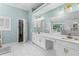 Spacious bathroom with dual vanity, a large mirror, and a glass-enclosed shower and tub at 3183 Robinwood Trl, Decatur, GA 30034