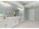 Bathroom with double vanity, modern lighting, and glass shower at 3183 Robinwood Trl, Decatur, GA 30034