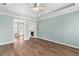 Bedroom featuring tray ceiling, fireplace, and access to backyard at 3183 Robinwood Trl, Decatur, GA 30034