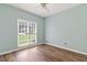 Bedroom with new flooring and a large window at 3183 Robinwood Trl, Decatur, GA 30034