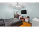 Cozy bedroom with mounted TV and modern decor at 3183 Robinwood Trl, Decatur, GA 30034