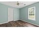 Cozy bedroom with ceiling fan, window and door to another room at 3183 Robinwood Trl, Decatur, GA 30034