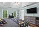 Bedroom features modern furniture, a TV, and natural light at 3183 Robinwood Trl, Decatur, GA 30034