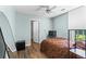 Light blue bedroom featuring an orange rug and tv at 3183 Robinwood Trl, Decatur, GA 30034
