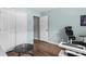 Bedroom featuring wood floors, closet, and an ensuite door at 3183 Robinwood Trl, Decatur, GA 30034