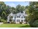 Charming white two-story home with black shutters and well-manicured landscaping at 3183 Robinwood Trl, Decatur, GA 30034