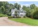 Charming two-story home boasts manicured lawn and mature trees at 3183 Robinwood Trl, Decatur, GA 30034