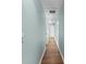 Hallway with wood floors leading to bedrooms and living areas at 3183 Robinwood Trl, Decatur, GA 30034