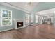 Open living area with fireplace, access to kitchen, and backyard patio at 3183 Robinwood Trl, Decatur, GA 30034