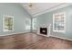 Living room with fireplace, vaulted ceiling, fan, and lots of natural light at 3183 Robinwood Trl, Decatur, GA 30034