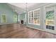 Bright living room with fireplace, multiple windows, and a ceiling fan at 3183 Robinwood Trl, Decatur, GA 30034