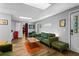 Living room area featuring a green sofa and accent wall at 3183 Robinwood Trl, Decatur, GA 30034
