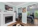 View of the living room and a bedroom that features a white fireplace, and modern decorations at 3183 Robinwood Trl, Decatur, GA 30034