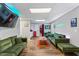 Spacious lounge area featuring modern decor, comfortable couches, an entertainment area, and warm lighting at 3183 Robinwood Trl, Decatur, GA 30034