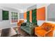 Inviting lounge area featuring comfortable seating, designer wall art, and a bright window for natural light at 3183 Robinwood Trl, Decatur, GA 30034