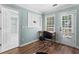 Bright home office space features a desk, a window, and access to the backyard and another room at 3183 Robinwood Trl, Decatur, GA 30034