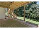 Covered back patio with stairs leading up to a deck, perfect for outdoor gatherings at 3183 Robinwood Trl, Decatur, GA 30034