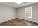 Bright room with laminate flooring and natural light from a window at 3183 Robinwood Trl, Decatur, GA 30034