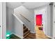 Staircase with wood treads and white risers, lit with LED at 3183 Robinwood Trl, Decatur, GA 30034