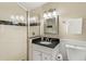 Well-maintained bathroom featuring a tiled shower, dark granite vanity, and updated fixtures at 3380 E Wood Valley Rd, Atlanta, GA 30327
