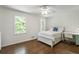 Serene bedroom featuring a bed with storage drawers, complemented by a pristine white color scheme at 3380 E Wood Valley Rd, Atlanta, GA 30327