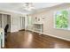 Bright bedroom with hardwood floors and a large window offering picturesque outdoor views at 3380 E Wood Valley Rd, Atlanta, GA 30327