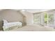 Cozy bedroom with French doors leading to a private balcony, offering natural light and charm at 3380 E Wood Valley Rd, Atlanta, GA 30327