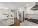 Bright kitchen with stainless steel appliances, gas range, white cabinets, and island with granite countertops at 3380 E Wood Valley Rd, Atlanta, GA 30327
