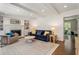 Charming living room features a fireplace, beamed ceiling, built-in shelving, and hardwood floors at 3380 E Wood Valley Rd, Atlanta, GA 30327