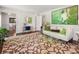Bright living room with a modern rug, contemporary decor, and hardwood floors for a cozy atmosphere at 3380 E Wood Valley Rd, Atlanta, GA 30327