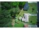 Bird's eye view displays fenced backyard, mature trees, and well-maintained exterior of a beautiful home at 4164 Weston Dr, Powder Springs, GA 30127
