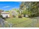 Fenced backyard with mature trees, manicured lawn and storage shed at 4164 Weston Dr, Powder Springs, GA 30127