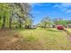 Large backyard with mature trees, storage sheds and plenty of space at 4164 Weston Dr, Powder Springs, GA 30127