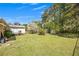 Spacious backyard featuring mature trees, green lawn and storage shed at 4164 Weston Dr, Powder Springs, GA 30127