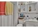 Small bathroom showcasing a shower, sink, vanity, and an accent mirror at 4164 Weston Dr, Powder Springs, GA 30127