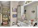Cozy bathroom featuring decorative wallpaper, tub/shower, and a classic vanity at 4164 Weston Dr, Powder Springs, GA 30127